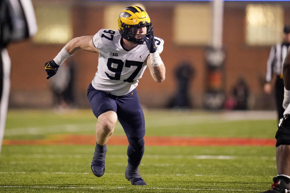 FILE - Michigan defensive end Aidan Hutchinson rushers against Maryland during the first half of an NCAA college football game, Saturday, Nov. 20, 2021, in College Park, Md. Hutchinson was selected to The Associated Press All-Big Ten team in results released Tuesday, Dec. 7, 2021. (AP Photo/Julio Cortez, File)