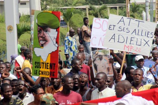 People march in Bamako last month in support of the military junta that seized power in a March 22 coup. Laborious talks have taken place between the regional mediators and the soldiers and a new team arrived in Bamako this week to try and thrash out a solution