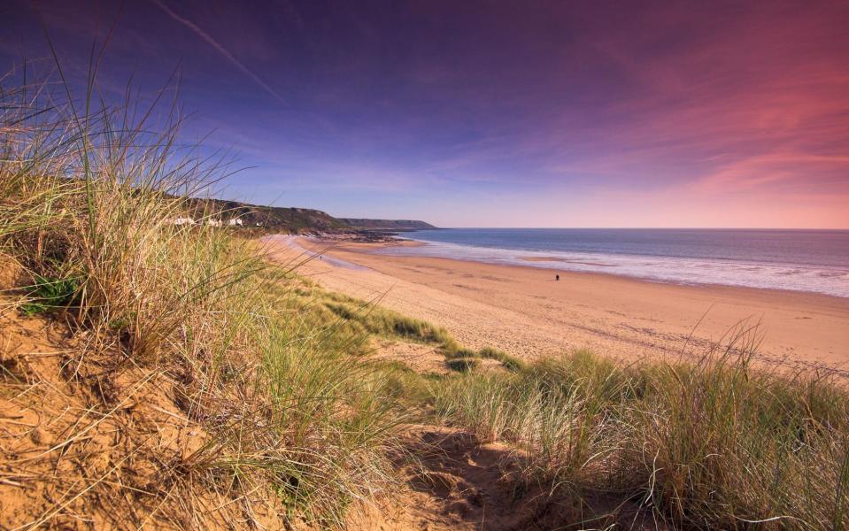 Eastern Slade Farm has sweeping views of Port Eynon Bay (pictured) - Credit: ALAMY