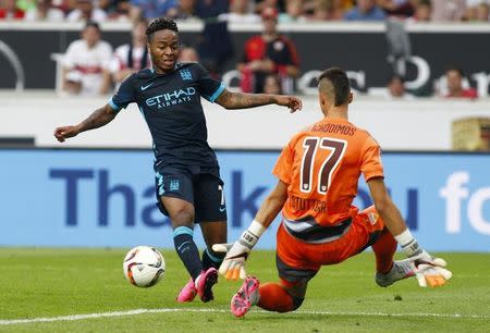 Football - VfB Stuttgart v Manchester City - Pre Season Friendly - The Mercedes-Benz Arena, Stuttgart, Germany - 1/8/15 Manchester City's Raheem Sterling passes the ball to Edin Dzeko before he scores their second goal Action Images via Reuters / John Marsh Livepic