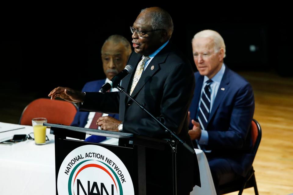 Rep. James Clyburn, D-S.C., speaks as then-presidential candidate Joe Biden listens during the National Action Network South Carolina Ministers' Breakfast on Feb. 26, 2020.