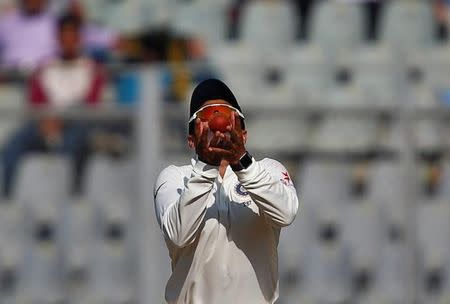 Cricket - India v England - Fourth Test cricket match - Wankhede Stadium, Mumbai, India - 8/12/16. India's Karun Nair takes the catch of England's Moeen Ali. REUTERS/Danish Siddiqui