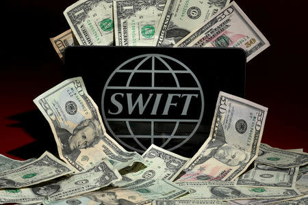 The SWIFT logo is pictured in this photo illustration taken April 26, 2016. REUTERS/Carlo Allegri/File Photo