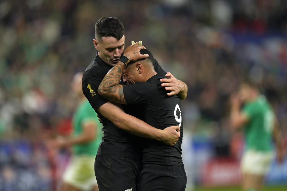 New Zealand's Aaron Smith, right, and New Zealand's Will Jordan react after the Rugby World Cup quarterfinal match between Ireland and New Zealand at the Stade de France in Saint-Denis, near Paris Saturday, Oct. 14, 2023. New Zealand won the match 28-24. (AP Photo/Thibault Camus)