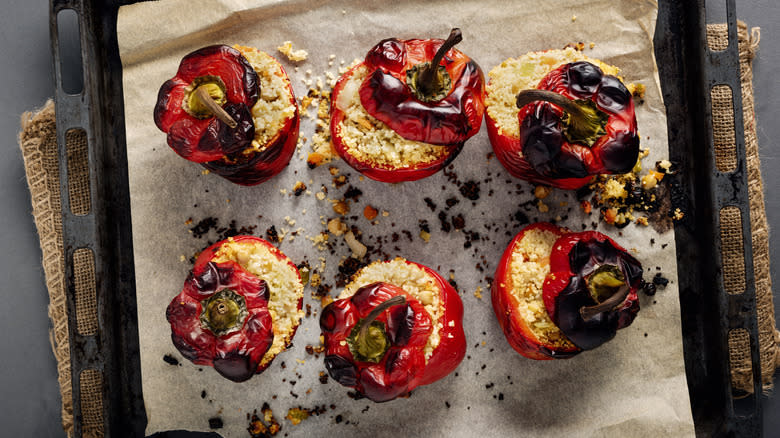 Stuffed red bell peppers on sheet tray