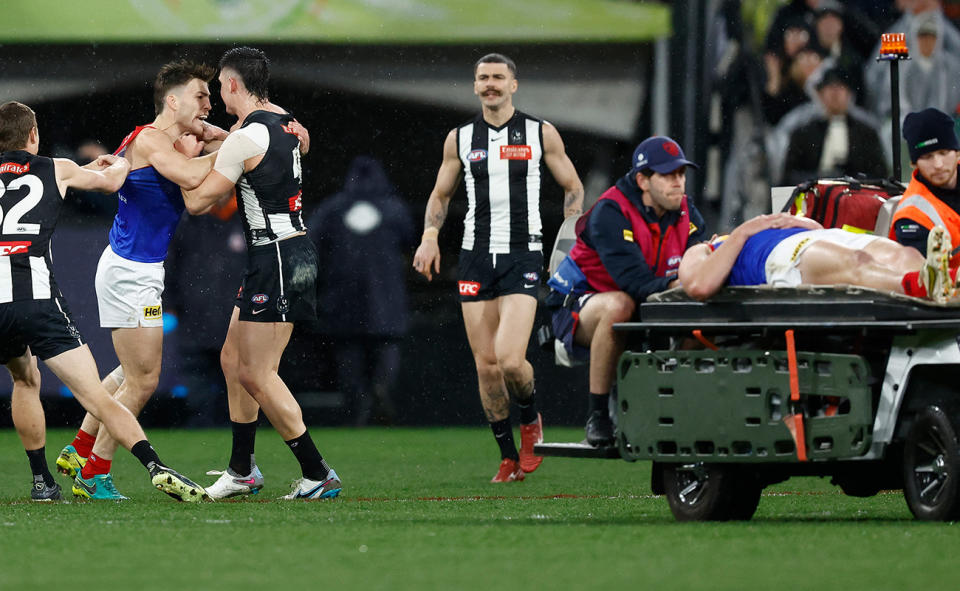 Melbourne players, pictured here remonstrating with Brayden Maynard after he knocked out Angus Brayshaw.