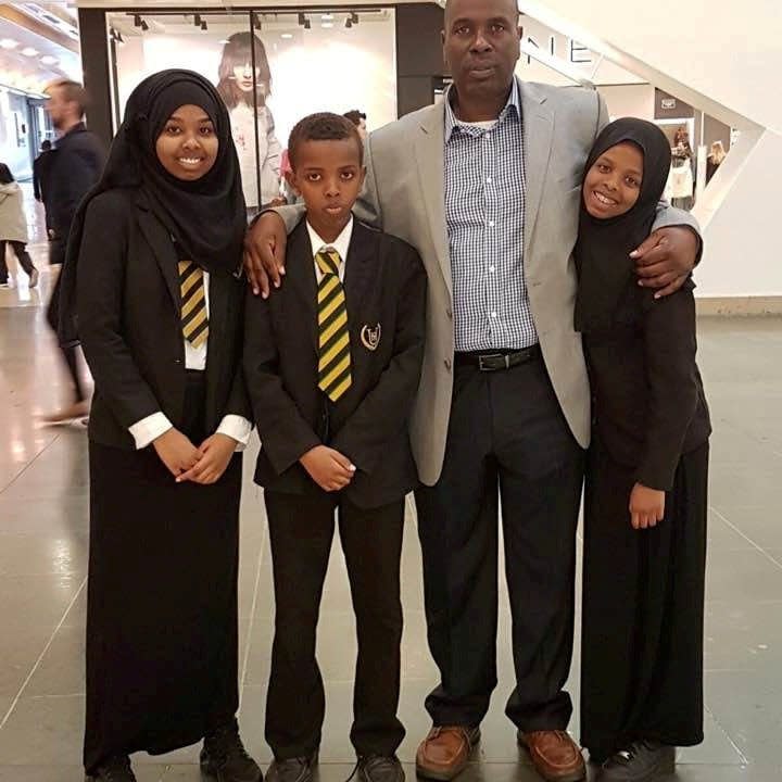 Father Idris Hamud with his daughters Sumayyah, now 19, and Ilham, now 17 and his son - Idris Hamud / SWNS 