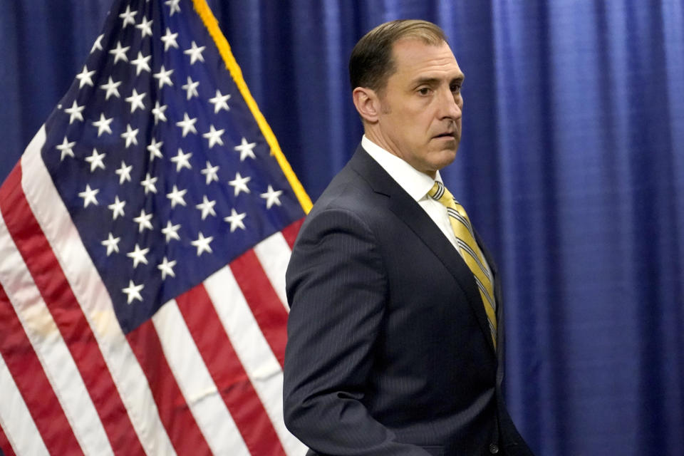 John R. Lausch Jr., United States Attorney for the Northern District of Illinois, walks to the podium to announce the federal indictment of Michael Madigan, the former speaker of the Illinois House, on racketeering and bribery charges during a news conference Wednesday, March 2, 2022, in Chicago. Madigan, for decades one of the nations' most powerful legislators, is the most prominent politician swept up in the latest federal investigation of entrenched government corruption in the state. (AP Photo/Charles Rex Arbogast)