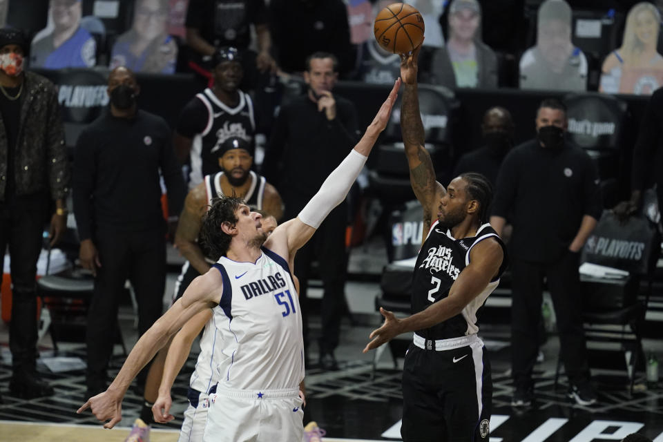 Dallas Mavericks center Boban Marjanovic (51) defends against Los Angeles Clippers forward Kawhi Leonard (2) during the second quarter of Game 7 of an NBA basketball first-round playoff series Sunday, June 6, 2021, in Los Angeles, Calif. (AP Photo/Ashley Landis)