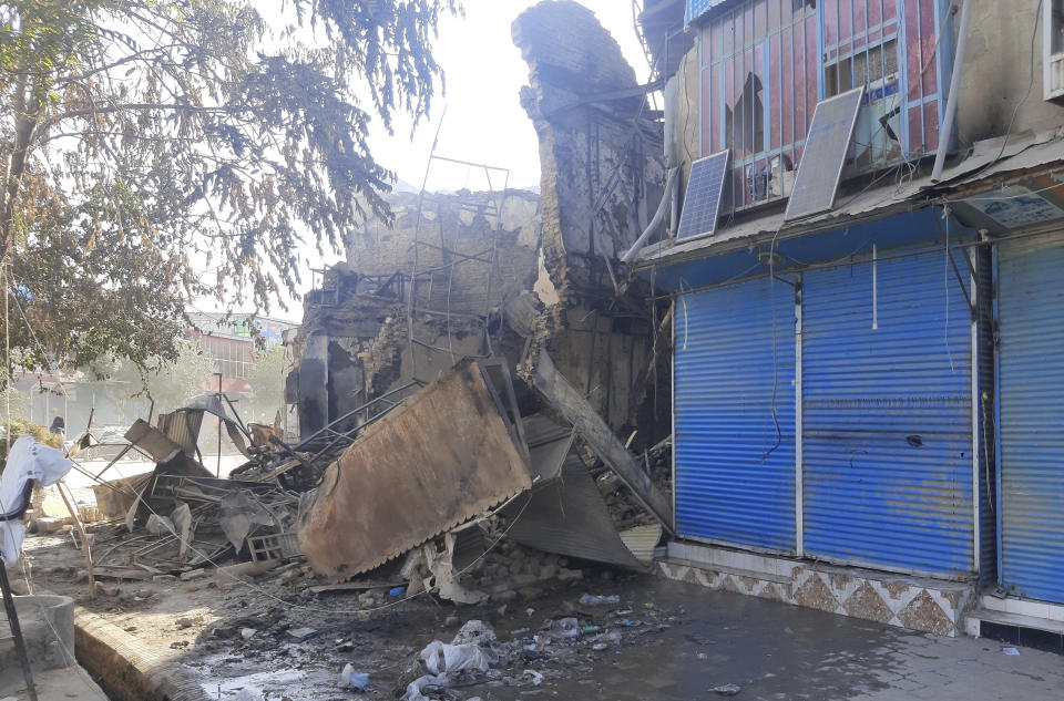 Shops are damaged after fighting between Taliban and Afghan security forces in Kunduz city, northern Afghanistan, Sunday, Aug. 8, 2021. Taliban fighters Sunday took control of much of the capital of Kunduz province, including the governor's office and police headquarters, a provincial council member said. (AP Photo/Abdullah Sahil)