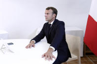 French President Emmanuel Macron attend a video-conference with members of European Council on Belarus situation at the Fort de Bregancon, southern France, Wednesday Aug. 19 2020. European Union leaders are putting on a show of support Wednesday for people protesting in Belarus. Emergency talks will aim to highlight their concern about the contested presidential election and ratchet up pressure on officials linked to the security crackdown that followed. (Guillaume Horcajuelo / Pool via AP)