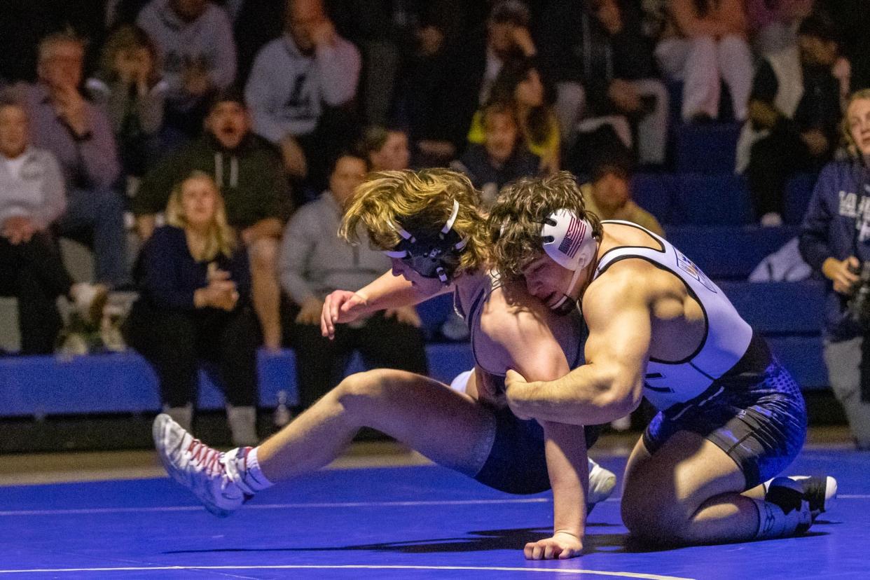 Conwell-Egan's Dante Burns, right, takes on La Salle's George Higgins in a 215-pound match in the Philadelphia Catholic League wrestling championship at Conwell-Egan in Fairless Hills on Monday, January 30, 2023. The Eagles toppled the Explorers 40-30 for the PCL title.