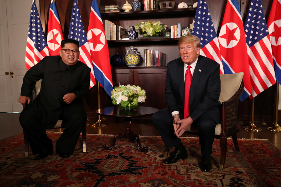 <p>President Donald Trump sits next to North Korea’s leader Kim Jong Un before their bilateral meeting at the Capella Hotel on Sentosa island in Singapore June 12, 2018. (Photo: Jonathan Ernst/Reuters) </p>