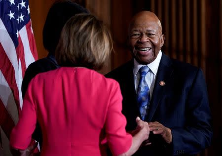 FILE PHOTO: Rep. Elijah Cummings (D-MD) greets Speaker of the House Nancy Pelosi (D-CA) before a ceremonial ceremonial swearing-in picture on Capitol Hill in Washington, U.S., January 3, 2019. REUTERS/Joshua Roberts/File Photo