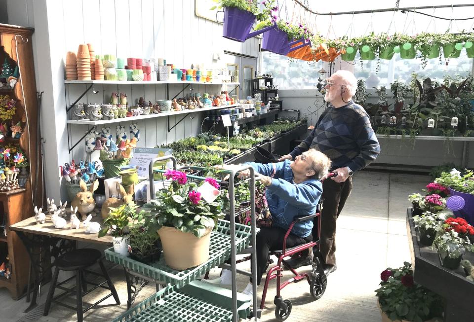 Rehoboth residents Seranne Tanguay and her husband Herve Tanguay shop for at Araujo Farms & Greenhouses on Monday, May 1, 2023.