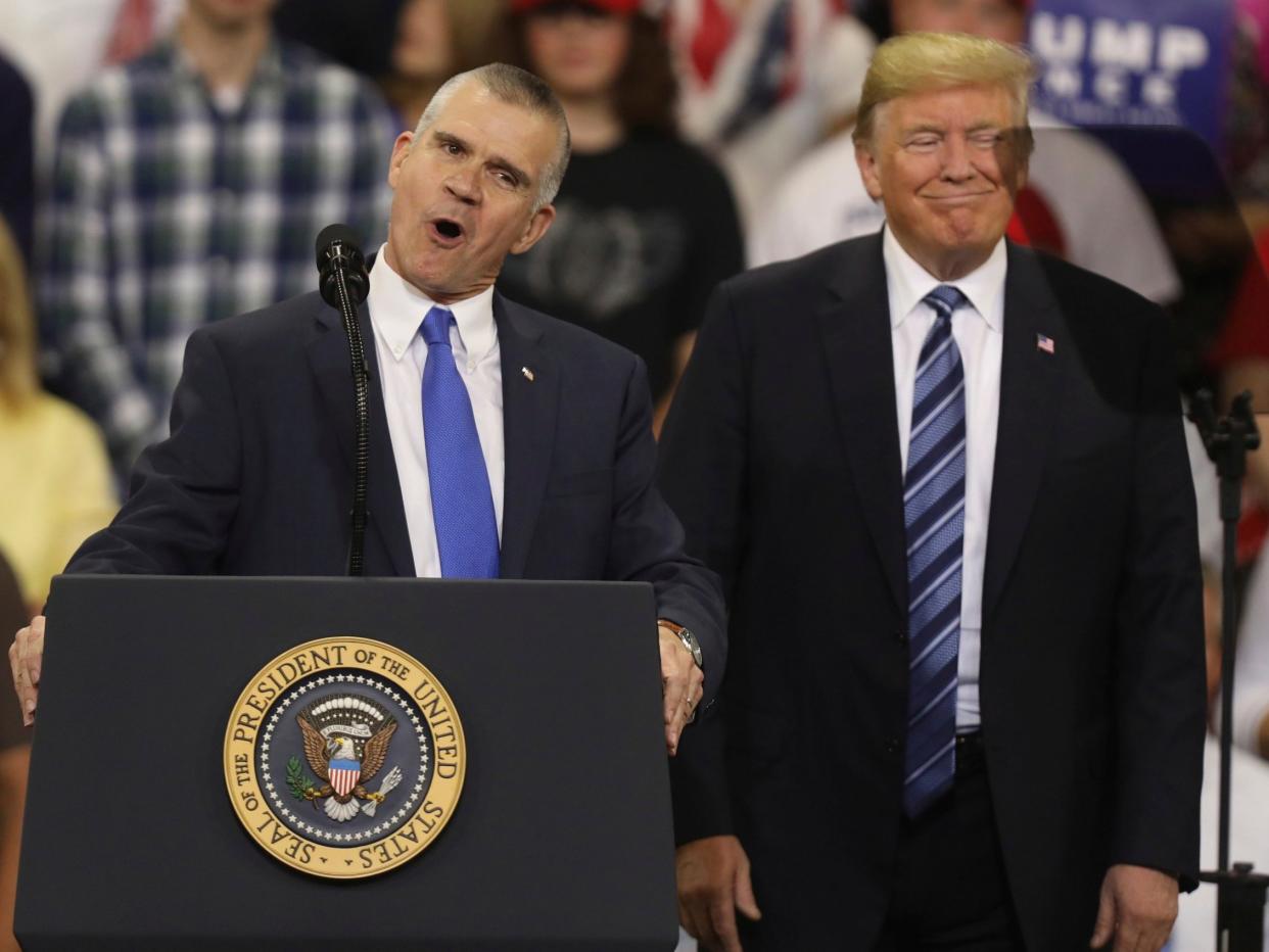 Republican Senate candidate Matt Rosendale and president Donald Trump speak at a rally in Billings, Montana, on 6 October: AP