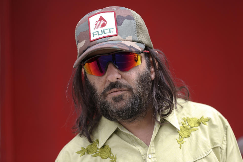 FILE - In this April 11, 2019 file photo, Los Angeles artist Erik Brunetti, the founder of the streetwear clothing company "FUCT," poses for a photo in Los Angeles. The Supreme Court has struck down a section of federal law that prevented officials from registering “scandalous” or “immoral” trademarks, handing a victory to a Los Angeles-based fashion brand spelled F-U-C-T (AP Photo/Damian Dovarganes)