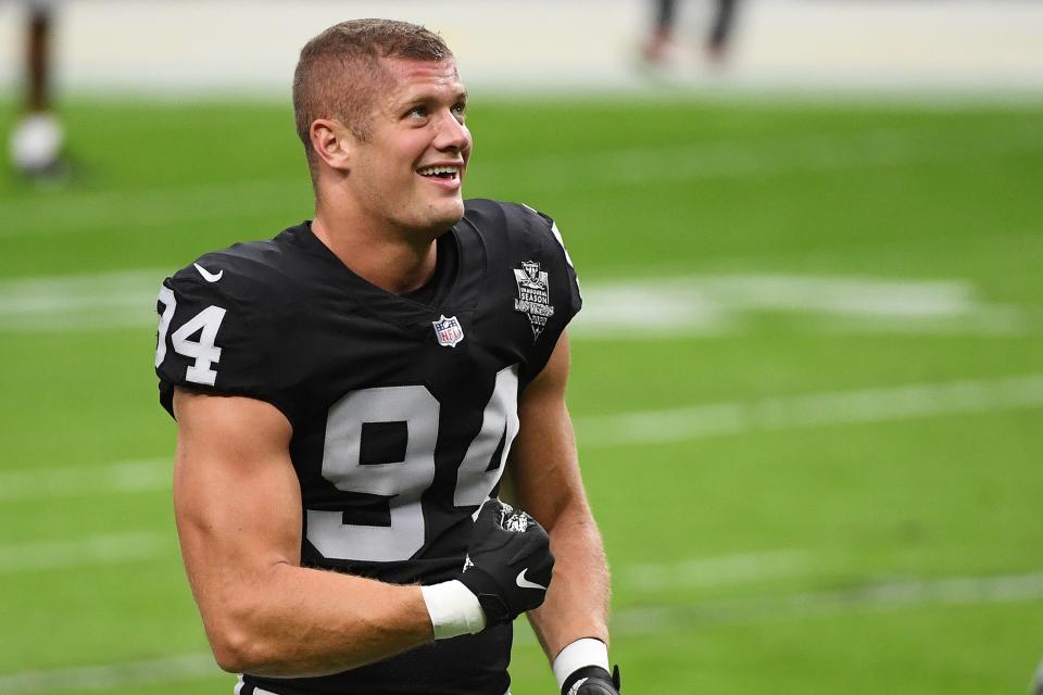 Carl Nassib  of the Las Vegas Raiders flexes while smiling during warmups before a game against the Denver Broncos at Allegiant Stadium on November 15, 2020 in Las Vegas, Nevada. (Getty Images)