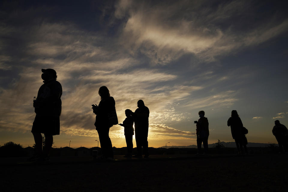 FILE - People wait in line to vote at a polling place before it opened on Election Day on Nov. 3, 2020, in Las Vegas. Nevada voters will consider a ballot question on Nov. 8, 2022, that would enshrine in the state constitution a ban on discrimination based on race, color, creed, sex, sexual orientation, gender identity or express, age, disability, ancestry or national origin. Nevadans will also weigh in on ranked-choice voting and the state's minimum wage. (AP Photo/John Locher, File)