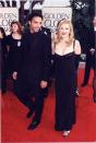 <p>Looking sexy in a low-cut black column dress for her Golden Globe win alongside Carlos Leon, father of her daughter Lourdes. <i>(Photo by Jeff Kravitz/FilmMagic, Inc)</i></p>