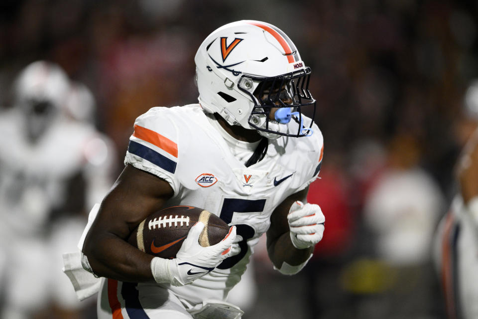 Virginia running back Kobe Pace carries during the first half of the team's NCAA college football game against Maryland, Friday, Sept. 15, 2023, in College Park, Md. (AP Photo/Nick Wass)