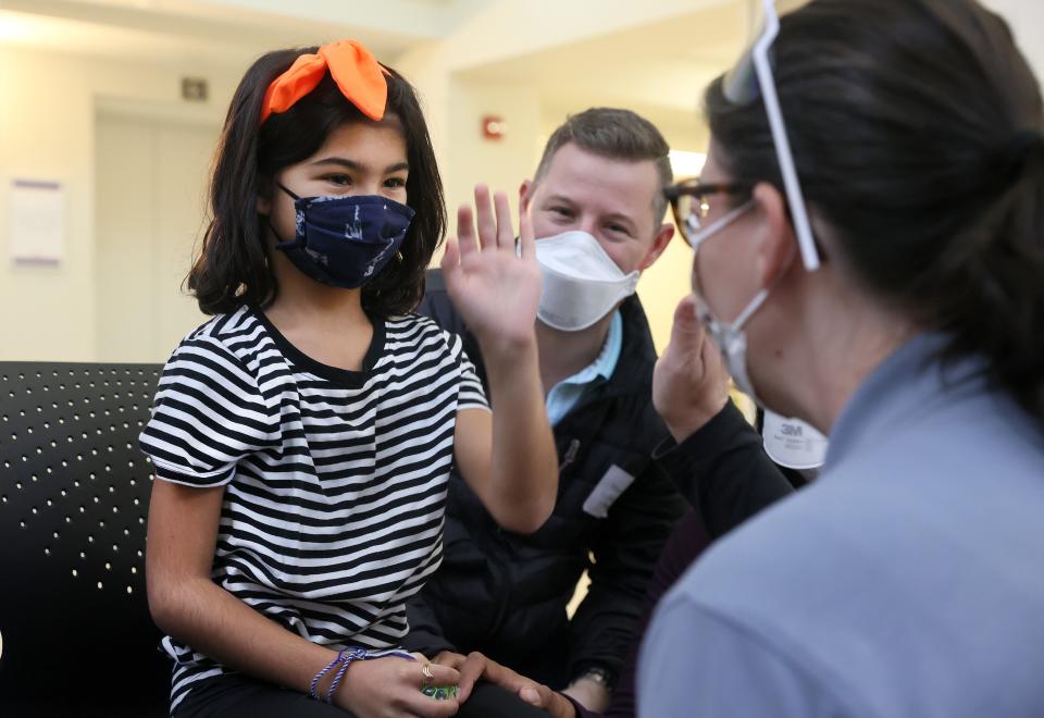 Raiya Randolph, 9, high fives Anne Elizabeth Hattier after receiving her shot as children of staff members at Le Bonheur are some of the first to receive the Pfizer COVID-19 vaccine which has been approved for 5-11 year olds, at the children's hospital on Thursday, Nov. 4, 2021.