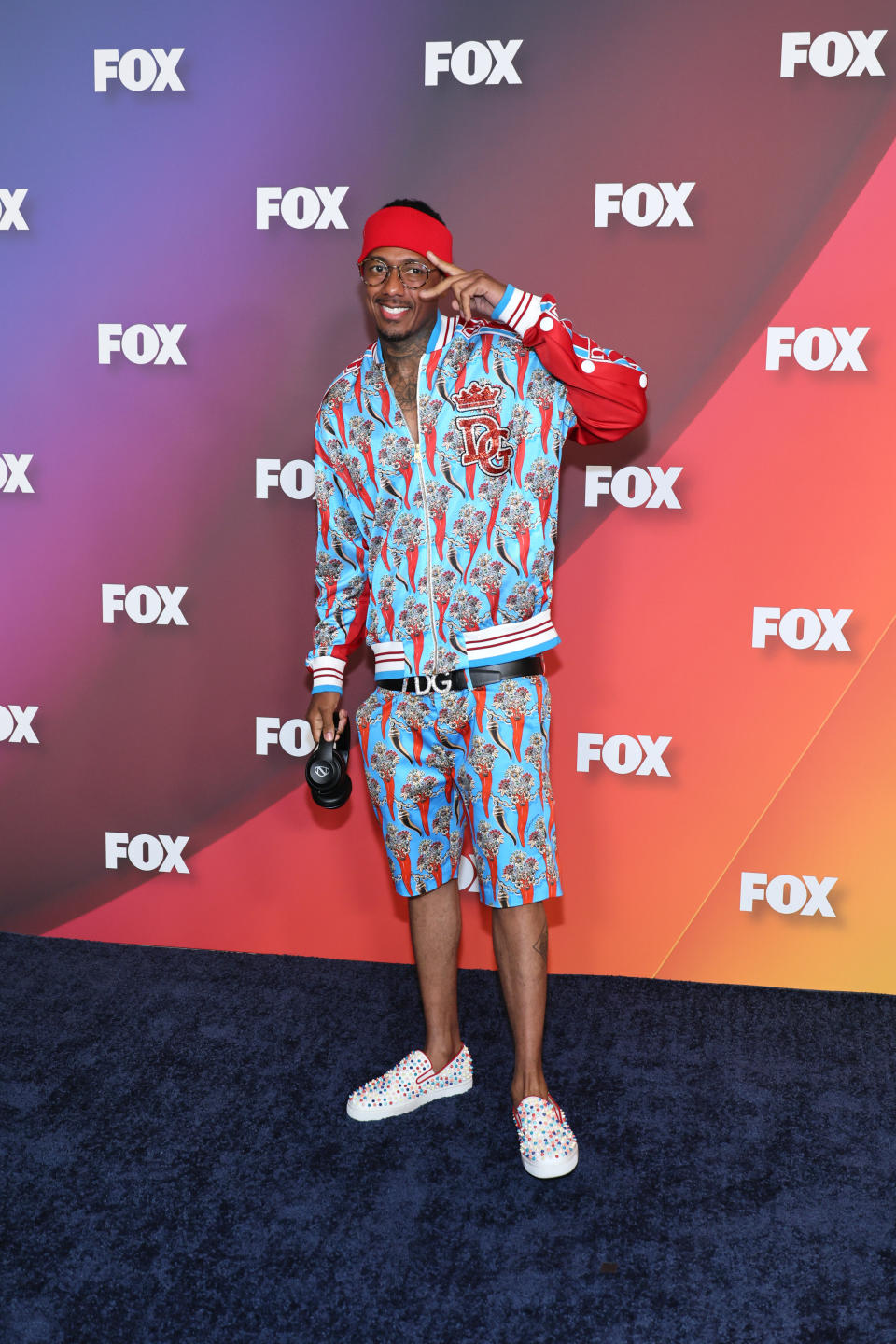 nick cannon in a multicolored outfit