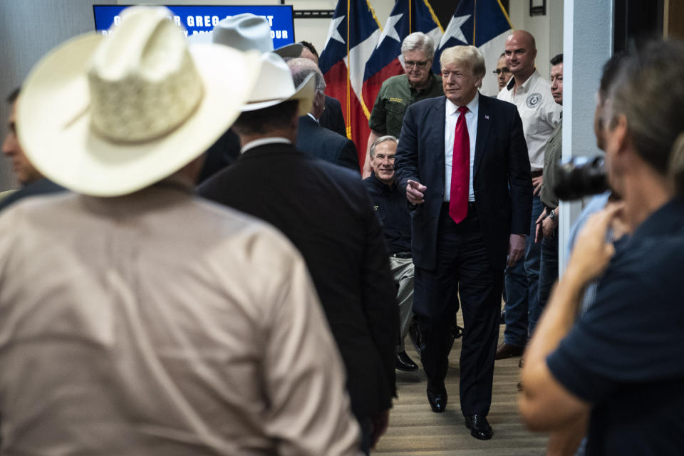Former President Donald J. Trump and Texas Gov. Greg Abbott depart after a security briefing with state officials and law enforcement at the Weslaco Department of Public Safety DPS Headquarters before touring the US-Mexico border wall on Wednesday, June 30, 2021 in Weslaco, Texas. (Jabin Botsford/The Washington Post via AP, Pool)