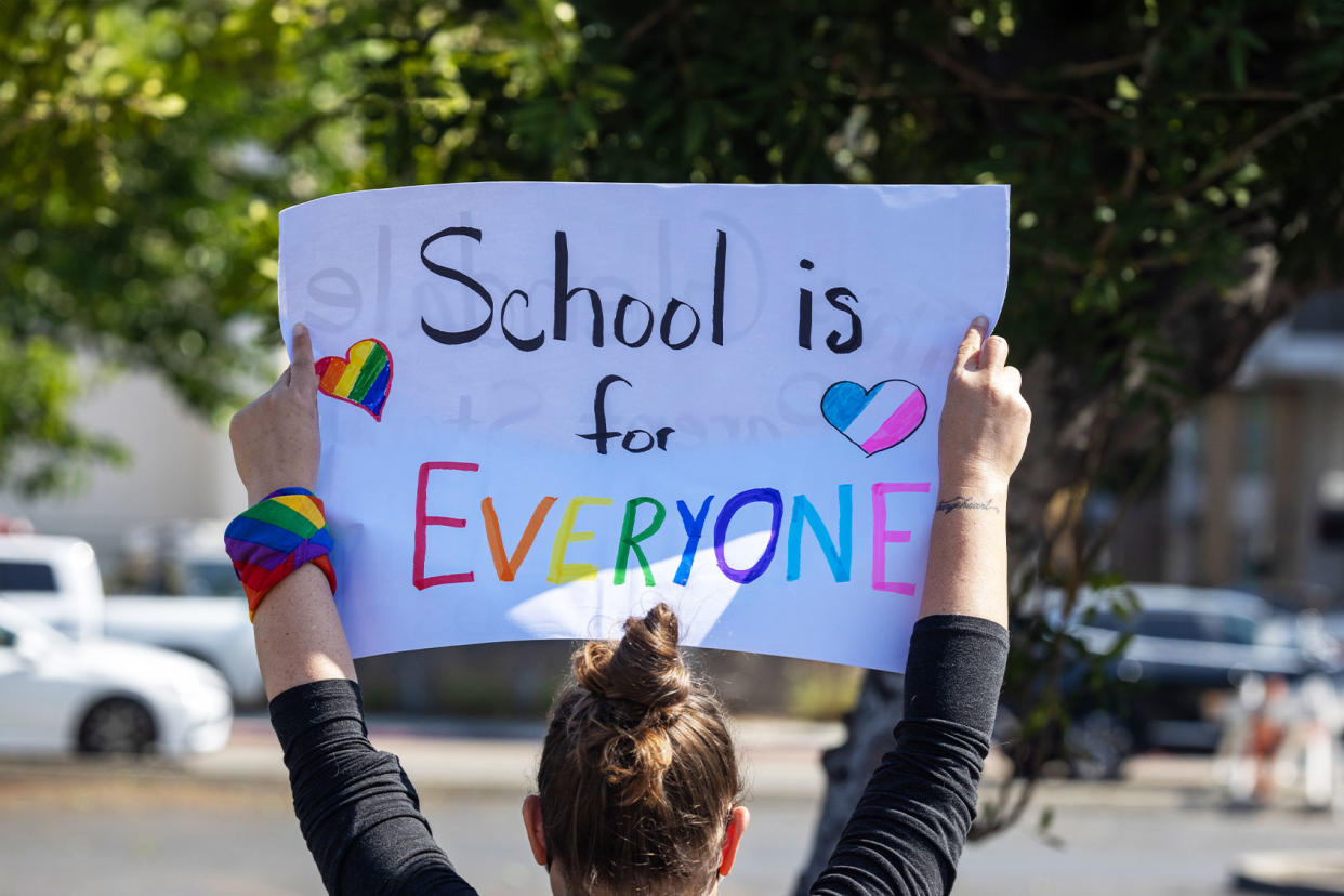 pro-LGBTQ+ demonstrator holds a sign David McNew/Getty Images