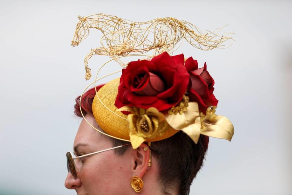 Sydney Ecker hand crafted the wire horse for her fascinator at Churchill Downs in Louisville, Ky., Saturday, May 4, 2024. She was wearing a gold jumpsuit with rose details that she created. “When you can’t find something to buy, you do it yourself,” she said. “I wanted to look like a walking Kentucky Derby Trophy.”