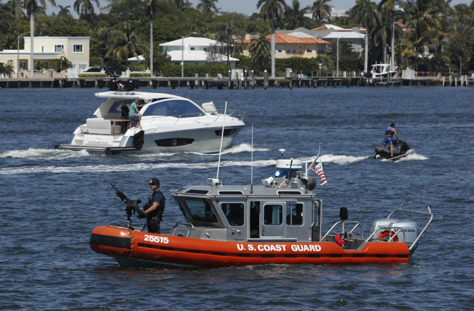 FILE - In this March 19, 2017 file photo, U.S. Coast Guard patrol Lake Worth Lagoon as President Donald Trump returns to his Mar-a-Lago estate in Palm Beach, Fla. It’s widely estimated that each trip to the resort costs taxpayers $3 million, based on a government study of the cost of a 2013 trip to Florida by President Barack Obama. But that trip was more complicated and the study’s author says it can’t be used to calculate the cost of Trump’s travel. This weekend, Trump is making his seventh visit to Mar-a-Lago since becoming president. (AP Photo/Manuel Balce Ceneta, File)