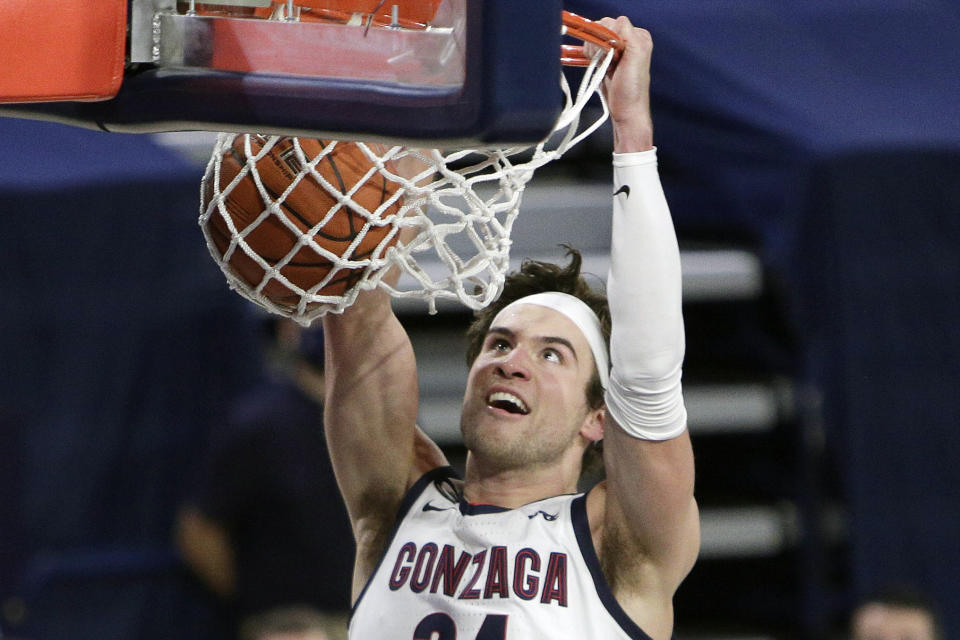 FILE - Gonzaga forward Corey Kispert dunks during the second half of an NCAA college basketball game against BYU in Spokane, Wash., in this Thursday, Jan. 7, 2021, file photo. Kispert has made The Associated Press All-America first team, announced Tuesday, March 16, 2021.(AP Photo/Young Kwak, File)