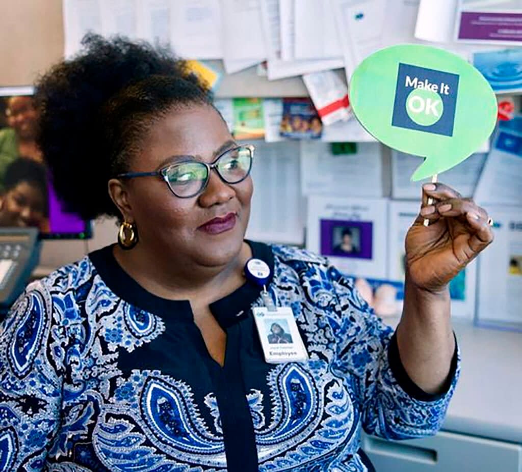 This undated image provided by Joyce Coleman shows Joyce Coleman at her office in Minneapolis. Coleman works to reduce the stigma of mental illness through conversation and education. (Joyce Coleman via AP)