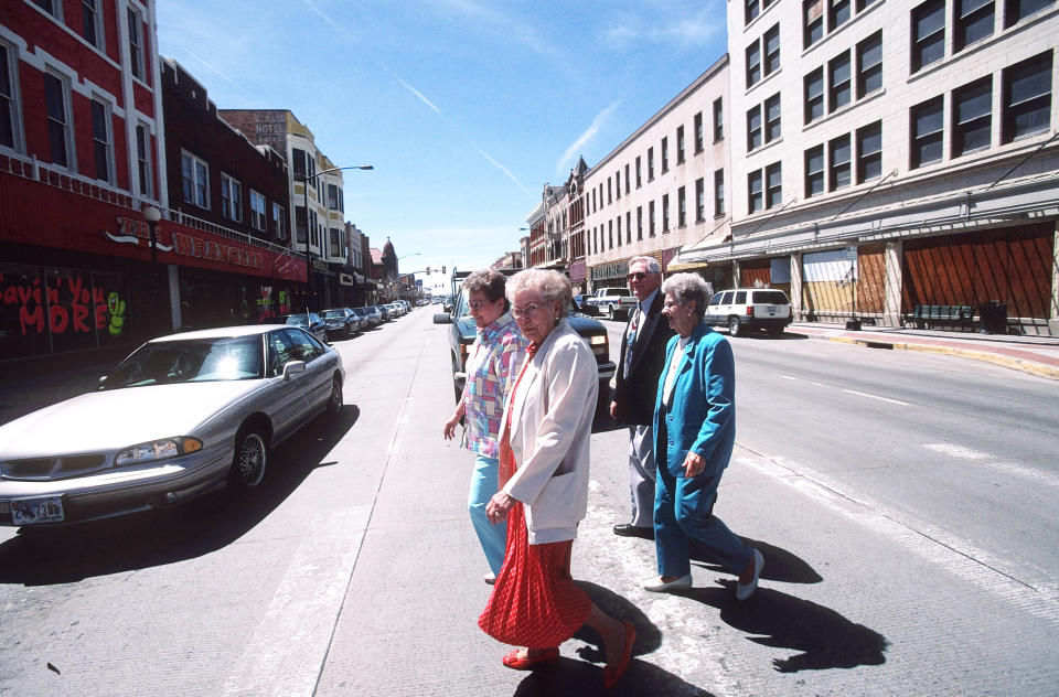 CHEYENNE,  WY - MAY 2: (US NEWS AND WORLD REPORT AND NEWSWEEK OUT) Four elderly residents of Cheyenne, Wyoming, cross a downtown intersection, May 2, 2004. Cheyenne is the capital of Wyoming with a population of 53,000. Wyoming was incorporated into the U.S.in 1890 and is the 9th largest U.S. state. A recent survey showed a hypothetical family in Cheyenne earning $90,000, pays the lowest amount in local, state and federal taxes in the U.S. compared to Bridgeport, Connecticut, where the highest taxes would be paid. Wyoming has a population of 500,000. It is a key energy producing state with vast coal and natural gas deposits. (Photo by Robert Nickelsberg/Getty Images)