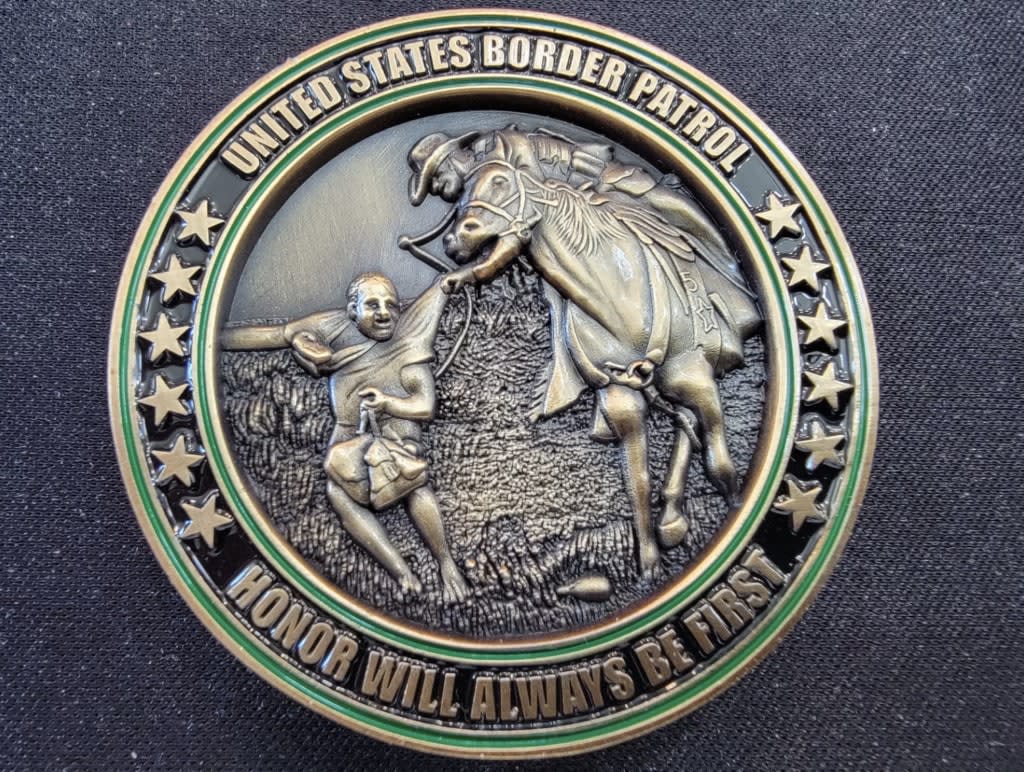 An image of the coin depicting a U.S. Border Patrol agent on horseback trying to apprehend a Haitian migrant. (via eBay, Andy Christiansen)