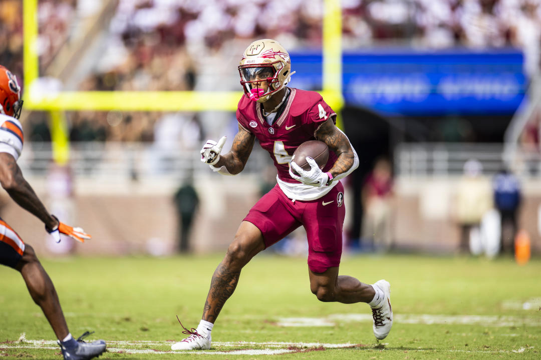 TALLAHASSEE, FLORIDA - OCTOBER 14: Keon Coleman #4 of the Florida State Seminoles runs with the ball during the first half of a game against the Syracuse Orange at Doak Campbell Stadium on October 14, 2023 in Tallahassee, Florida. (Photo by James Gilbert/Getty Images)