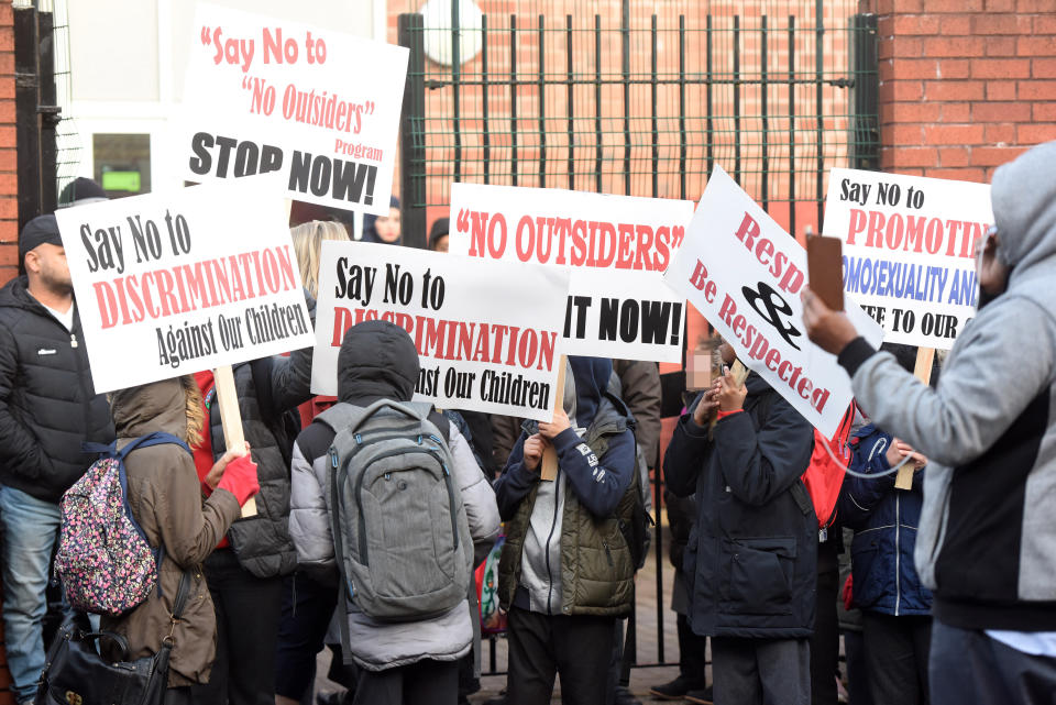 Parents and children demonstrate outside the Parkfield Community School, Birmingham.(Caters)