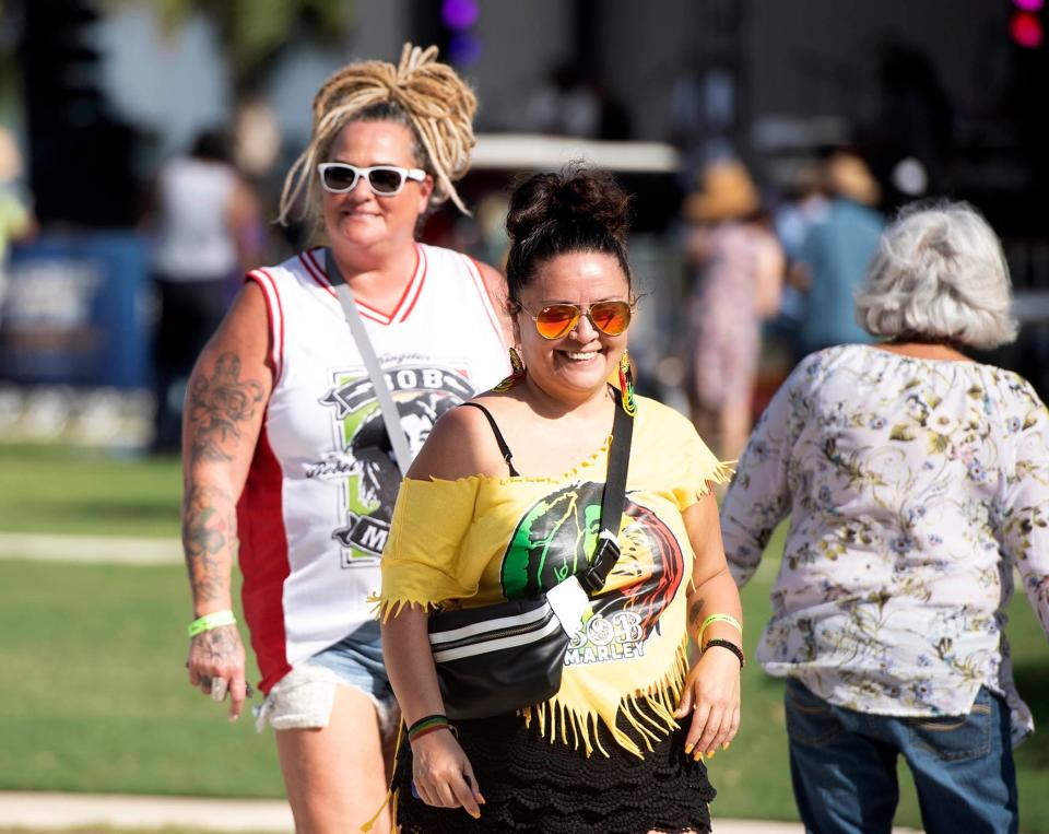  Allison Saner, left, and Samantha Pinzon, both of Hobe Sound listen to Orignal Wailers perform during Reggae Fest FL at Boynton Beach Amphitheater at Centennial Park Saturday November 12, 2022 in Boyton Beach. 