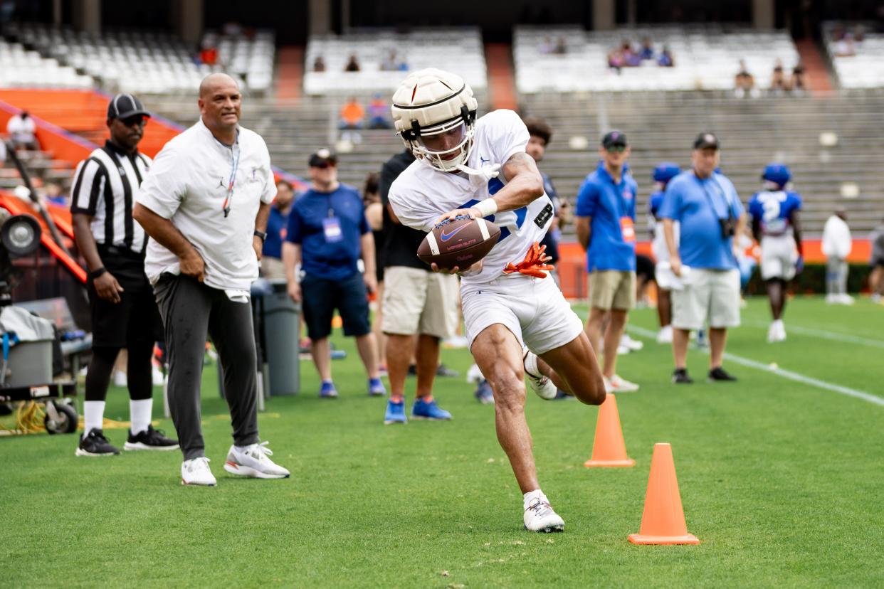 Florida Gators wide receiver Eugene Wilson III (21) makes a catch during fall football practice at Ben Hill Griffin Stadium at the University of Florida in Gainesville, FL on Saturday, August 5, 2023. [Matt Pendleton/Gainesville Sun]