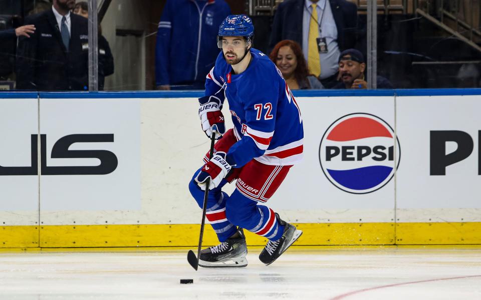 Sep 24, 2024; New York, New York, USA; New York Rangers center Filip Chytil (72) skates with the puck against the New York Islanders during the first period at Madison Square Garden.