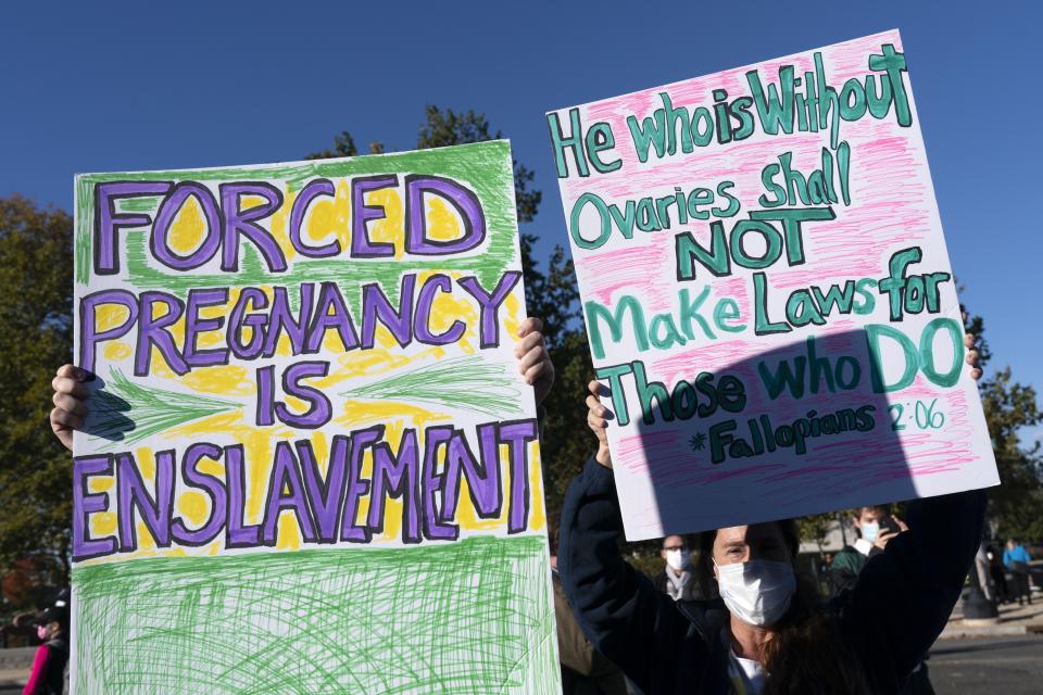 Jenni Coopersmith, right, of Montgomery County, Md., rallies for abortion rights with her daughter, Ava Stevenson, 20, left, outside the Supreme Court, Monday, Nov. 1, 2021, as arguments are set to begin about abortion by the court, on Capitol Hill in Washington. (AP Photo/Jacquelyn Martin)