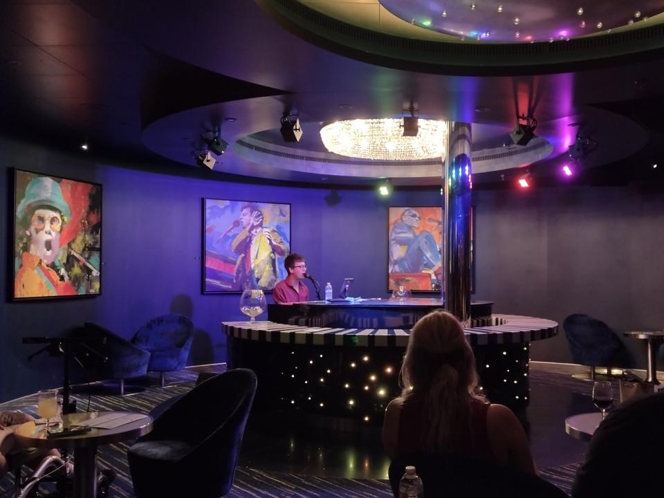 Shot of piano bar room on Carnival Radiance cruise ship