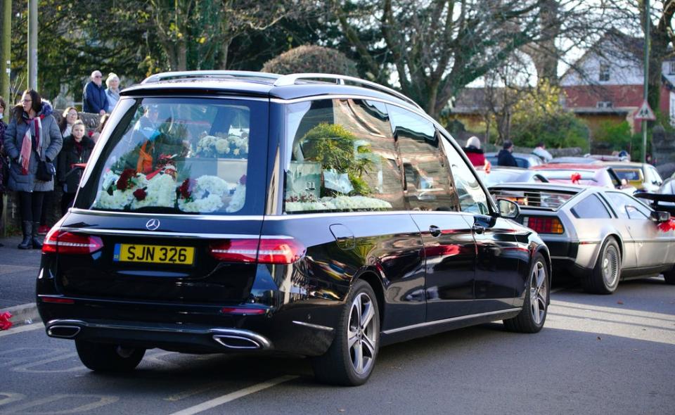 The hearse carrying the coffin of Jack Lis leaves St Martin’s Church, Caerphilly, after his funeral (PA) (PA Wire)