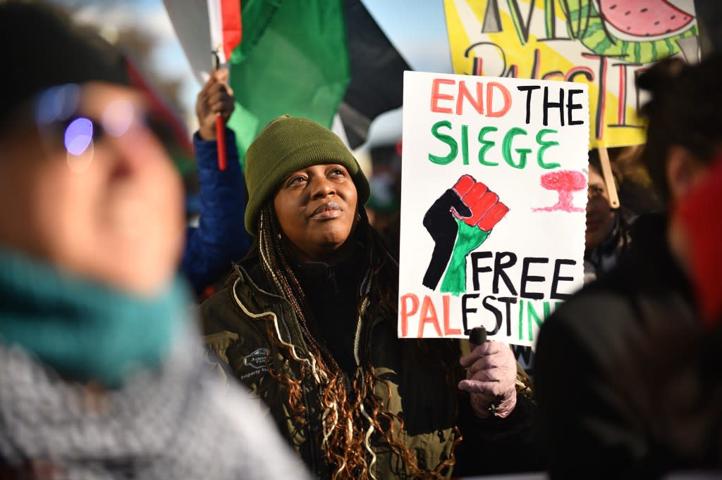 Lots Igwebuika, 32, from DC joins protesters at a rally at Freedom Plaza in Washington, D.C., January 13, 2024, in support of a ceasefire and Gaza in the war with Israel. (Astrid Riecken For The Washington Post via Getty Images)