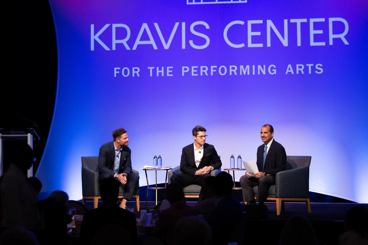 After their appearance in the Kravis Center's Corporate Partners Business Speaker Series event, Cody Crowell (left) and Rob Frisbie Jr. (center) spoke to the Daily News about the future of the Wells Fargo development site.