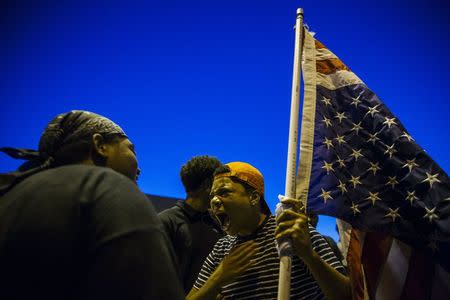 Anti-police demonstrators scream as they march in protest in Ferguson, Missouri August 10, 2015. REUTERS/Lucas Jackson