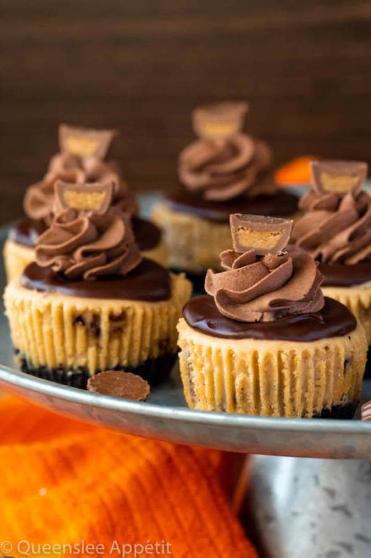 <p>Queenslee Appetit</p><p>These mini Reese’s peanut butter cheesecakes have a creamy peanut butter cheesecake filled with chopped Reese’s and topped with a peanut butter chocolate ganache and more!</p><p><strong>Get the recipe: <a href="https://www.queensleeappetit.com/mini-reeses-peanut-butter-cheesecakes/" rel="nofollow noopener" target="_blank" data-ylk="slk:Mini Reese's Peanut Butter Cheesecakes;elm:context_link;itc:0;sec:content-canvas" class="link rapid-noclick-resp">Mini Reese's Peanut Butter Cheesecakes</a></strong></p>