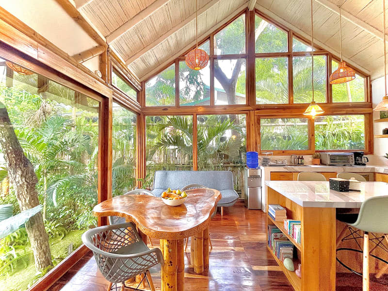 Wood and bamboo kitchen with walls of windows.