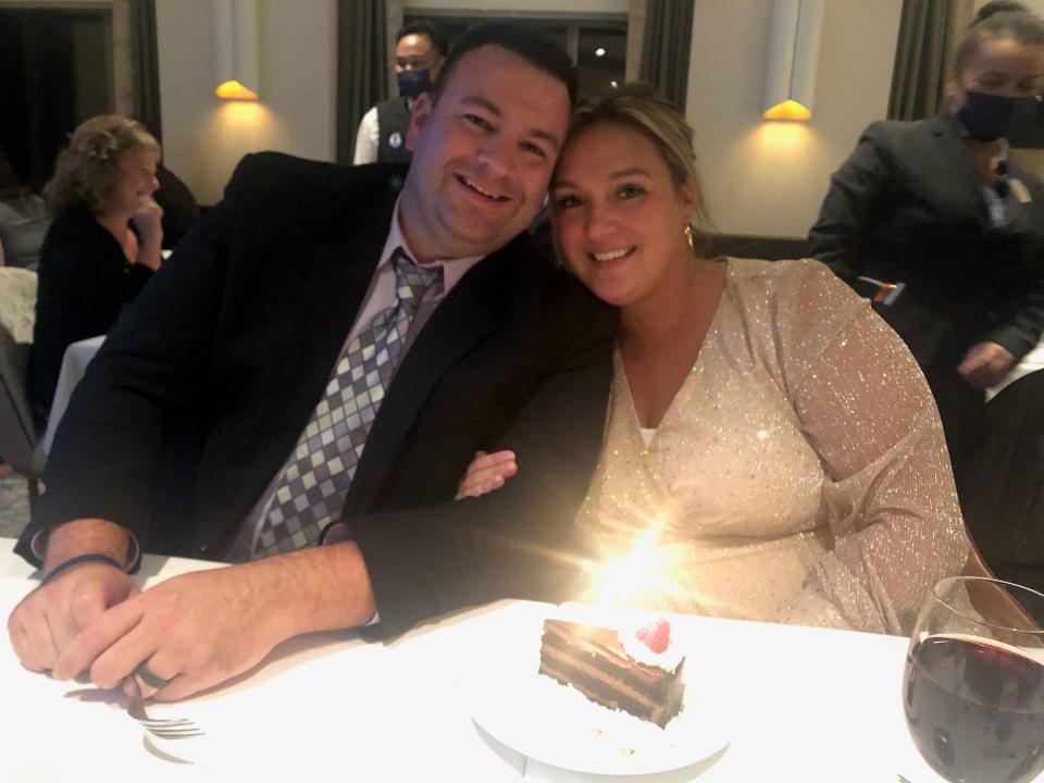 Steven and Brittany Loiler in the main dining room on Royal Caribbean's Odyssey of the Seas cruise ship in December, 2021. The Connecticut couple, on vacation to celebrate their first anniversary, tested positive for COVID-19 on the ship.