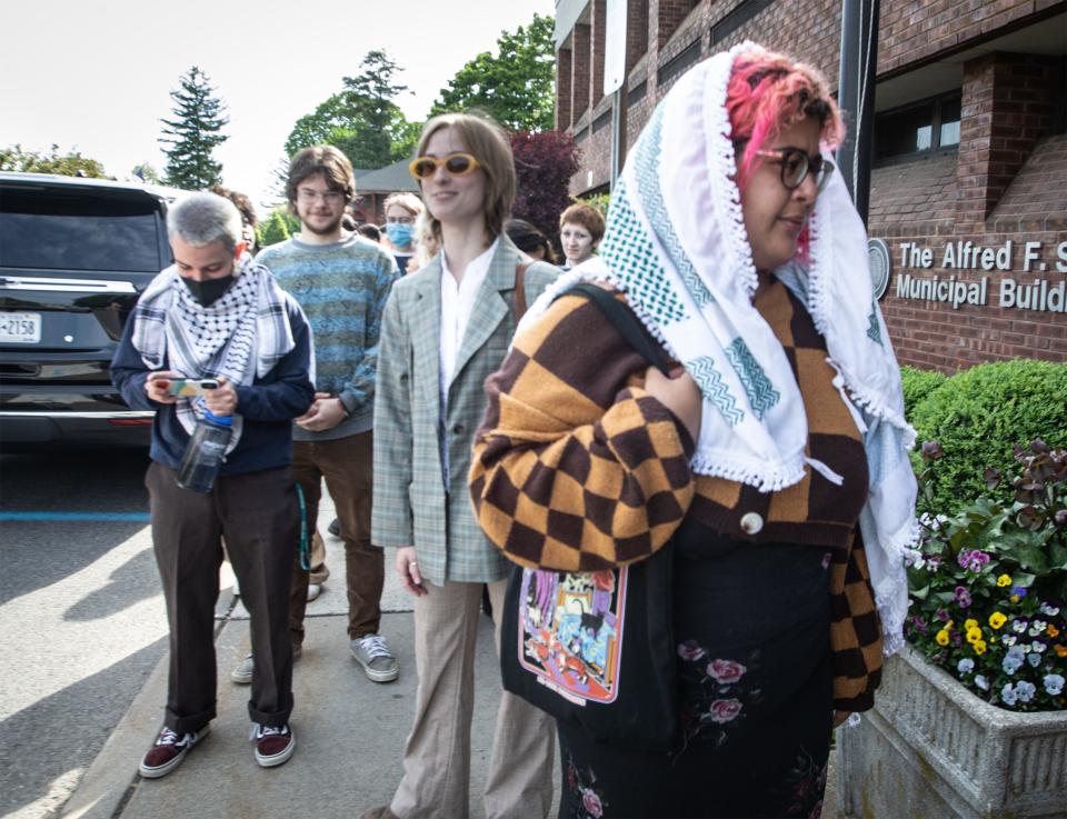 Purchase College students Sabrina Thompson, Kaelin Martin, Ian Justino, and several other students wait to enter the Town of Harrison Municipal Building May 14, 2024 where they were scheduled to appear in court after being arrested during demonstrations at a pro-Palestinian encampment on campus May 2nd.